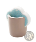 A soft beige ceramic diatom mud sponge rack holds a fluffy white and light blue porous kitchen sponge