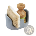 Gray silicone dish scrubber and brush holder with bamboo handle green band and beige sponge in kitchen sink caddy organizer