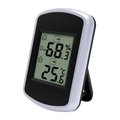 Silver and black digital indoor temperature and humidity gauge with comfort alert showing 25.6 degrees c and 68.3 percent humidity
