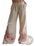Beige linen digital print casual wide-leg pants with intricate pink rose embroidery along the lower legs