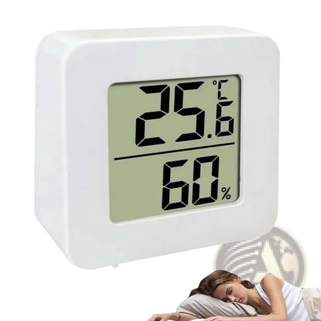 Digital thermometer and hygrometer room monitor in white displays 25.6°C and 60% humidity for bedside use