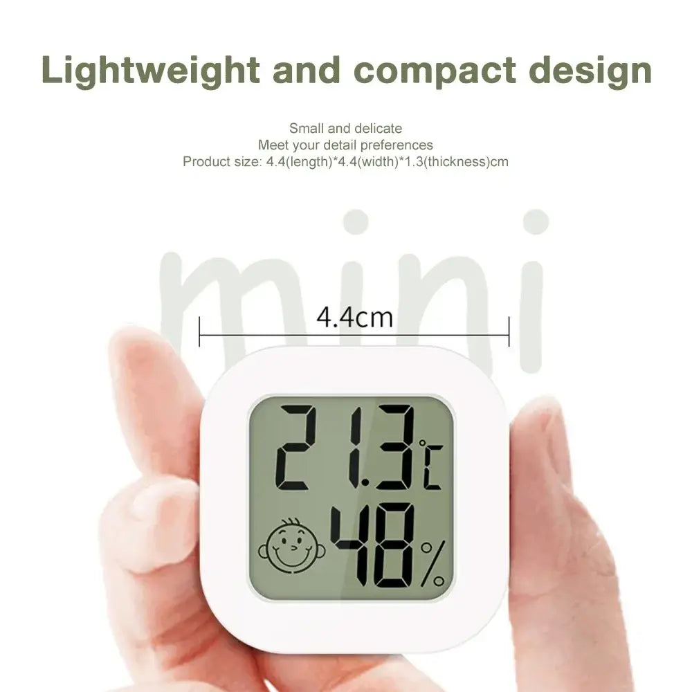 White square digital thermometer and hygrometer room sensor with smiling face icon dual display measurement range in celsius and humidity