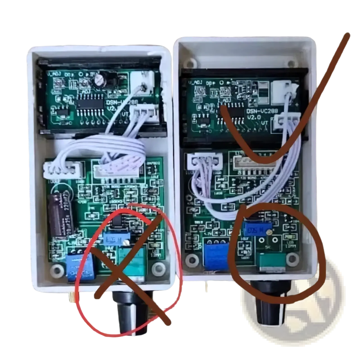 White plastic housing with green circuit boards and wiring of digital voltage current regulator 50a 60a 100a back side
