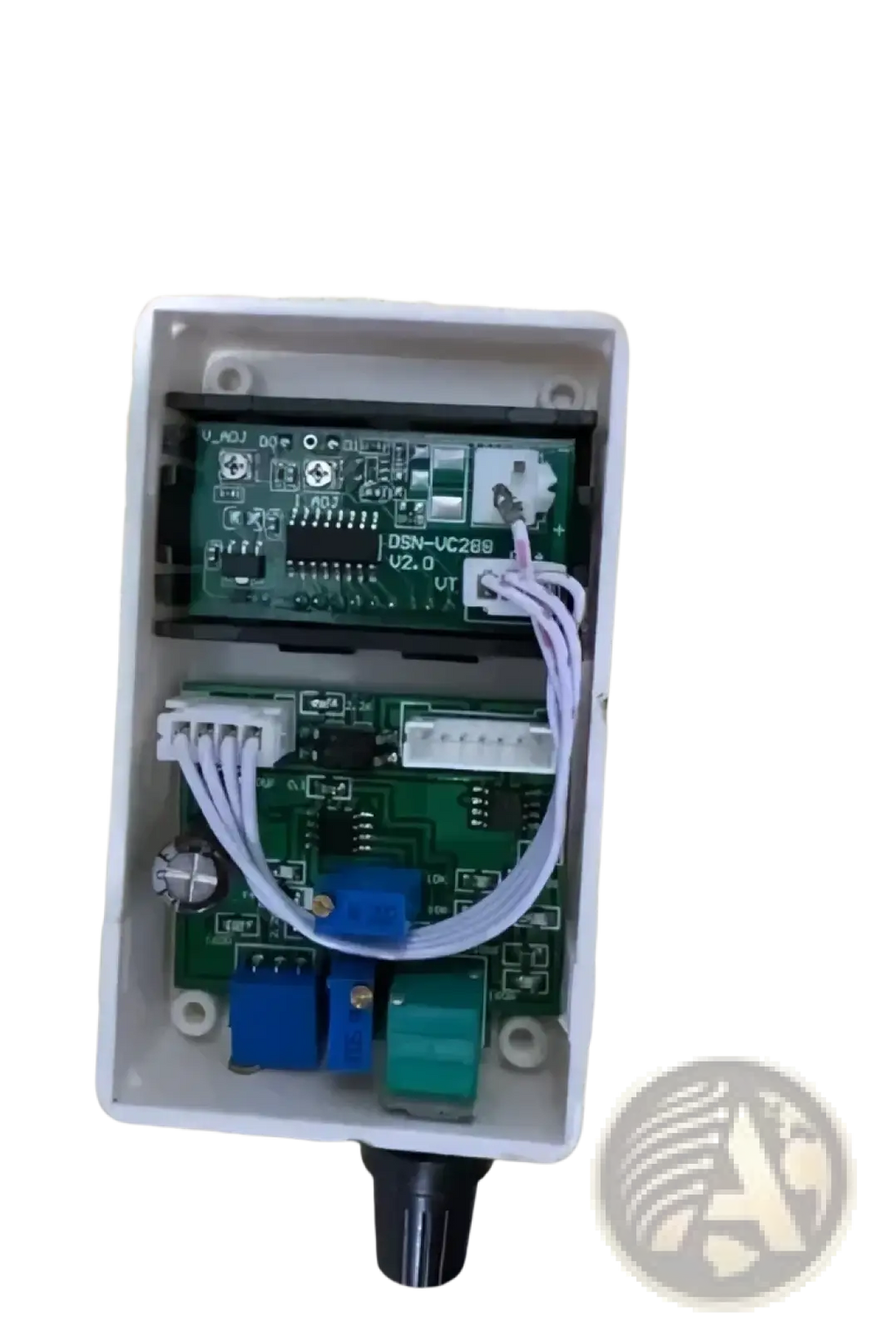 White plastic housing of digital voltage current regulator 50a 60a 100a showing two green circuit boards and black knob