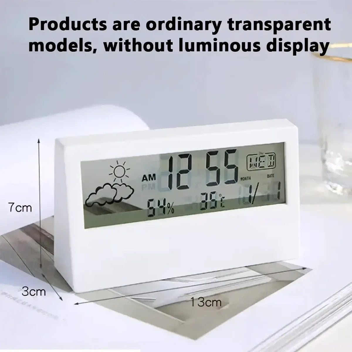 White rectangular digital weather desktop alarm clock with transparent display showing time temperature humidity and date