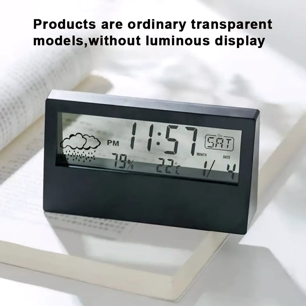 Black rectangular digital weather desktop alarm clock with transparent display showing time date weather temperature and humidity