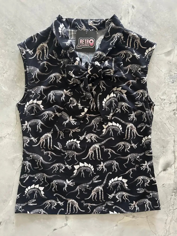 Black sleeveless cotton blouse with white dinosaur skeleton print and bow collar by Retro Licious