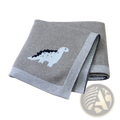 Gray knitted cotton baby blanket featuring a white and black dinosaur design with ribbed edges for crib use