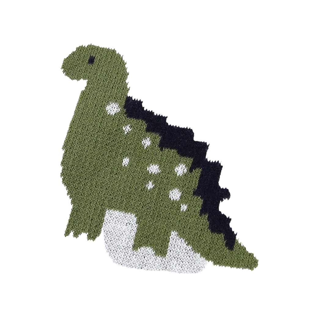A knitted green dinosaur with black spines and white spots on a cotton dinosaur knit baby blanket crib quilt