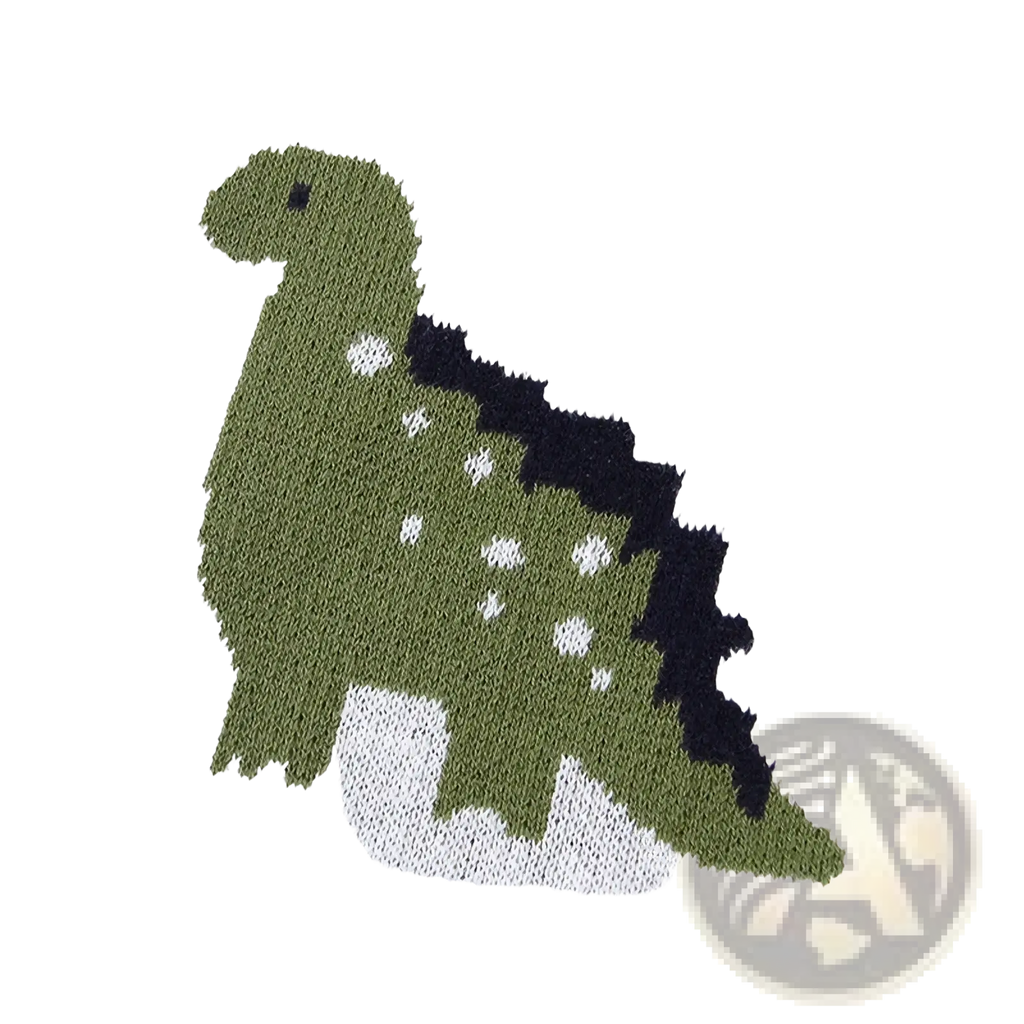 A knitted green dinosaur with black spines and white spots on a cotton dinosaur knit baby blanket crib quilt