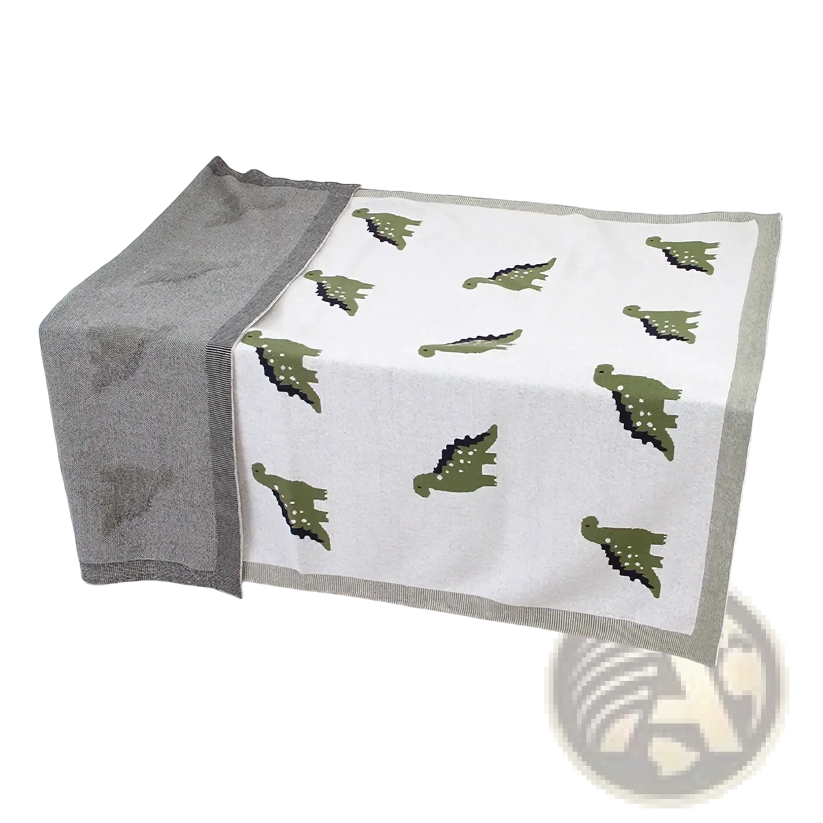 A soft white cotton dinosaur knit baby blanket with green prints and a gray border for crib use
