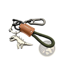 Silver dinosaur metal keychain with olive green braided cord and brown leather tag in dinosaur leather braided keychain product