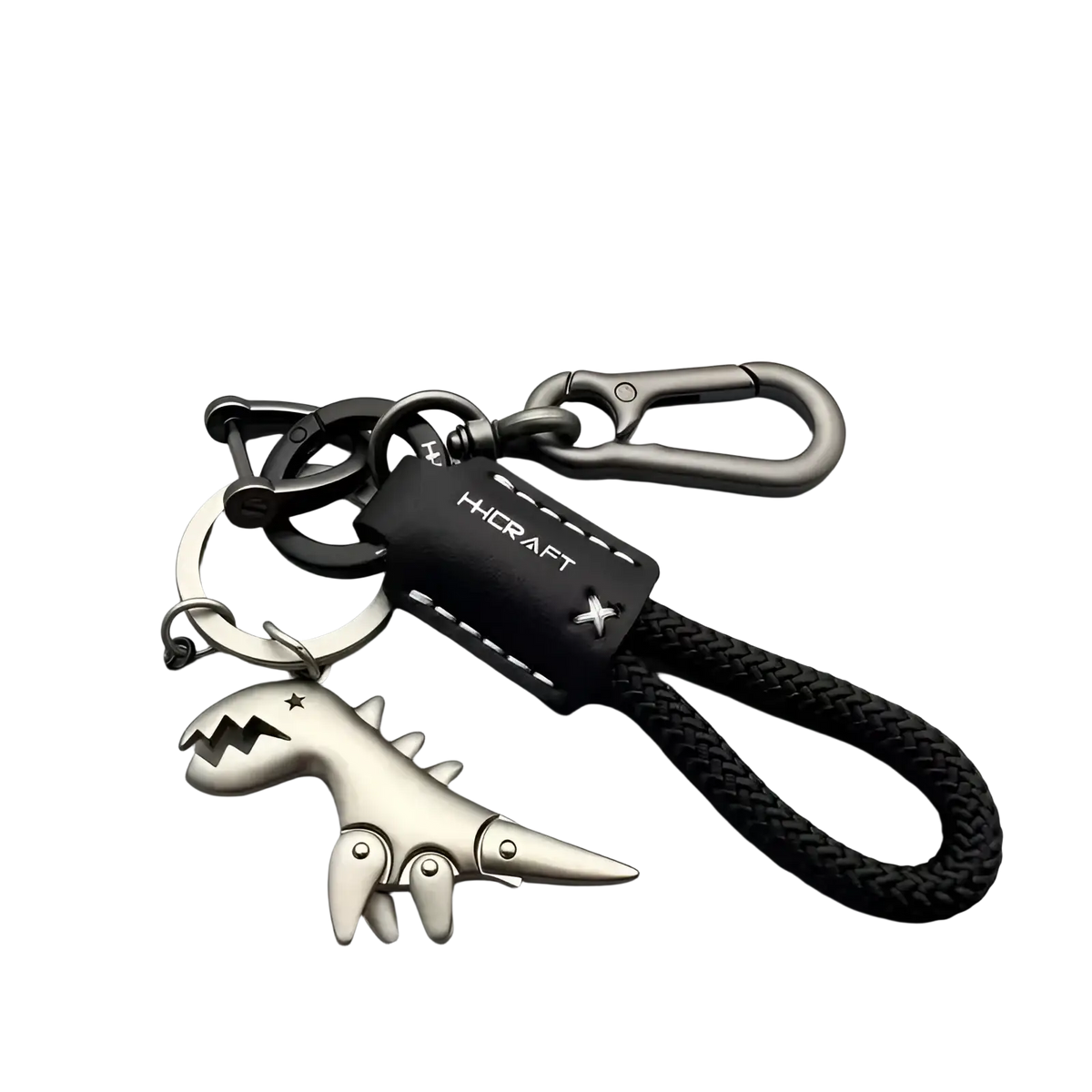 Silver dinosaur leather keychain bag pendant with black braided cord and leather tag for stylish accessory use