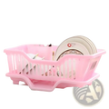 Pink plastic dish drying rack with slatted design and integrated legs for countertop organizer with drain board