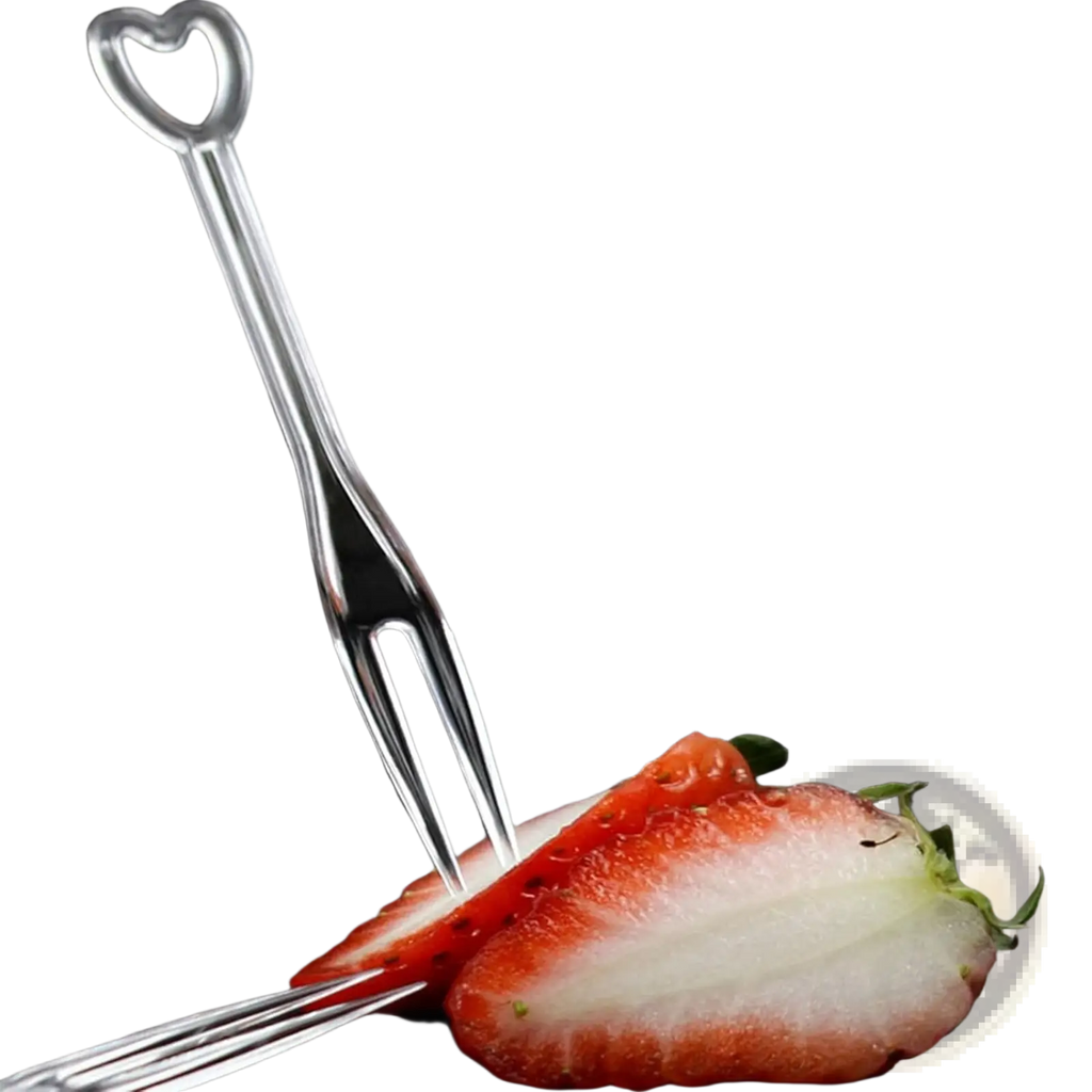 A shiny silver heart-shaped disposable tasting fork with three prongs piercing a red strawberry slice