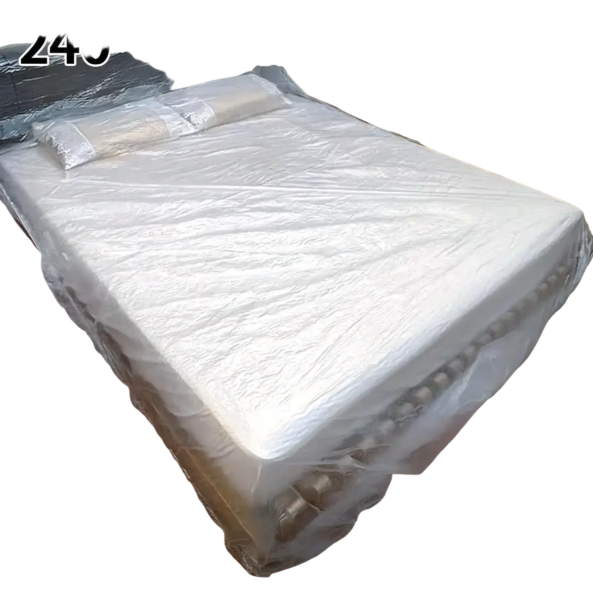 White plastic disposable waterproof mattress protector with clear slightly wrinkled surface and reinforced edges