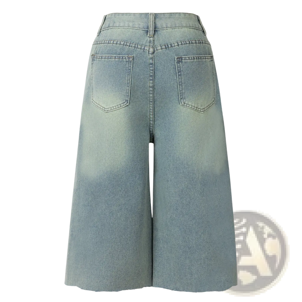 Distressed cropped denim pants in light-wash denim with a wide-leg cut and frayed hems