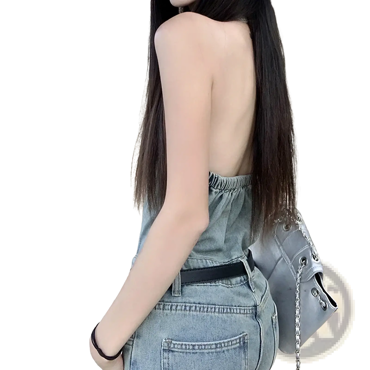 Gray chain-link shoulder bag with structured minimalist design and metallic hardware paired with distressed denim overalls