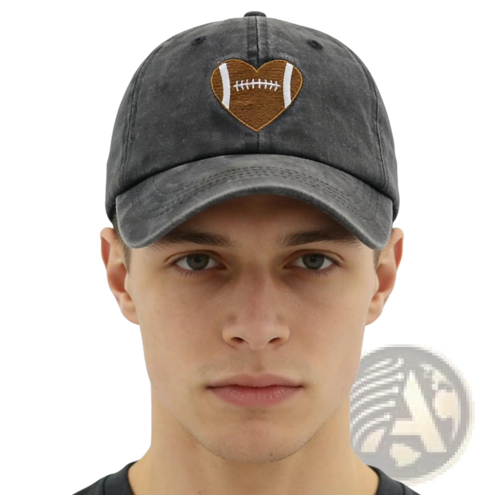 A dark gray distressed denim baseball cap with a brown and white heart-shaped football embroidery on the front