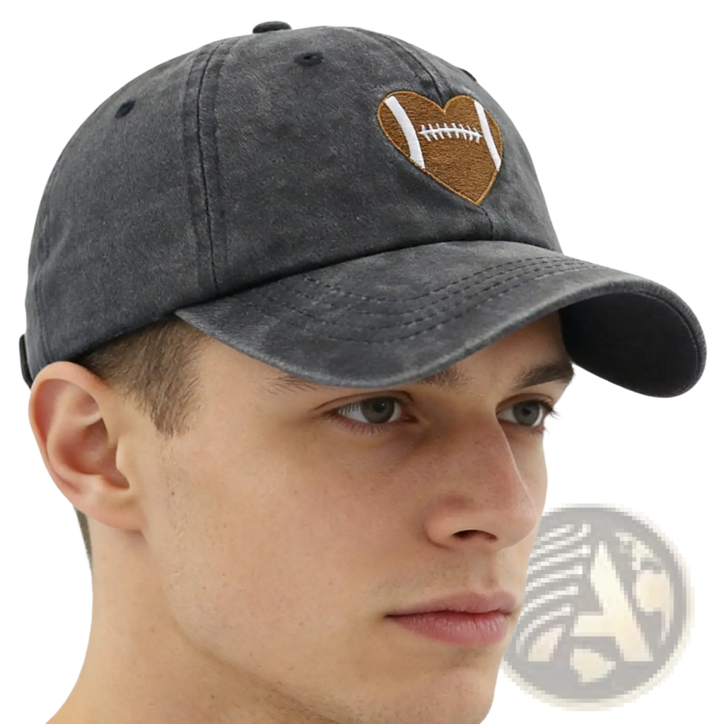 Dark gray distressed denim baseball cap featuring a heart-shaped football embroidered in brown and white thread