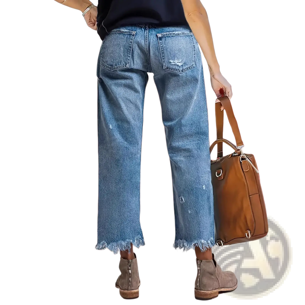 Distressed gray ripped straight jeans in light-wash denim with frayed hem and subtle distressing features