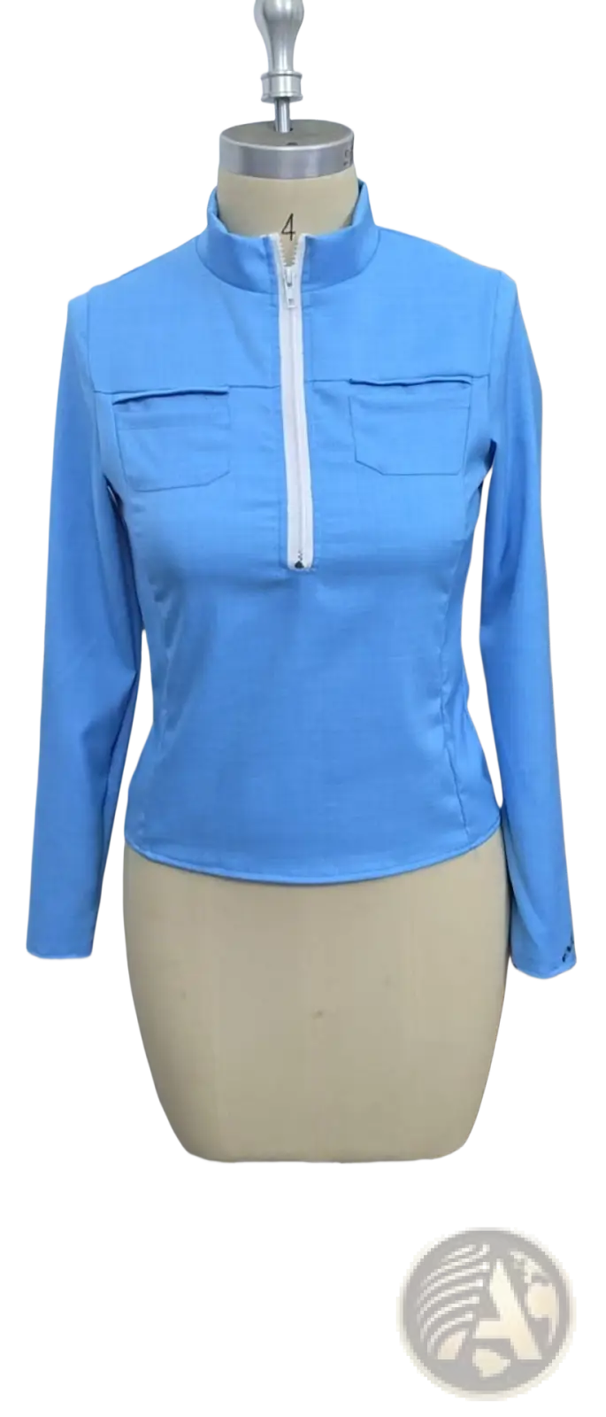 Light blue long-sleeved zip-up top with high collar and front pockets styled under distressed half zip denim jacket slim retro