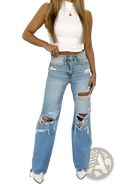 Distressed high waist light wash denim jeans featuring ripped knees and frayed edges in light-wash denim fabric