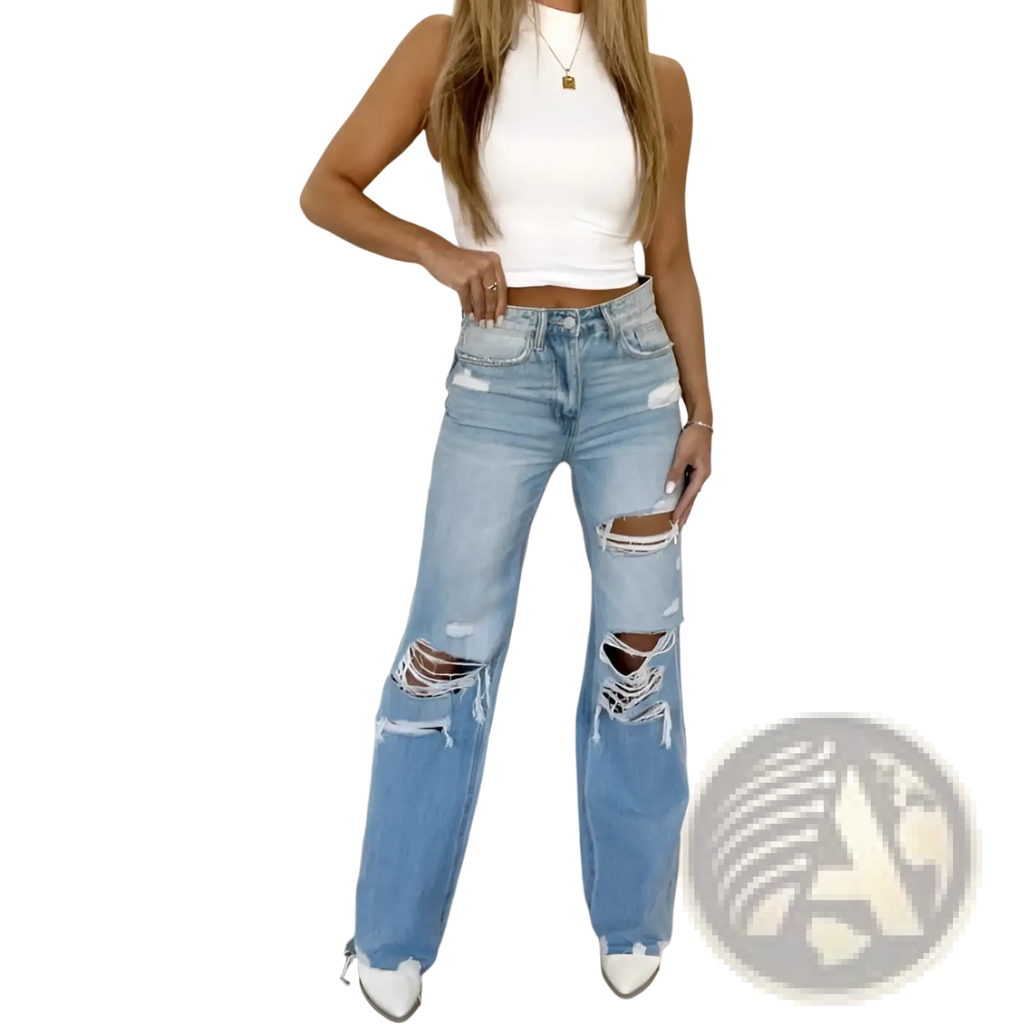 Distressed high waist light wash denim jeans featuring ripped knees and frayed edges in light-wash denim