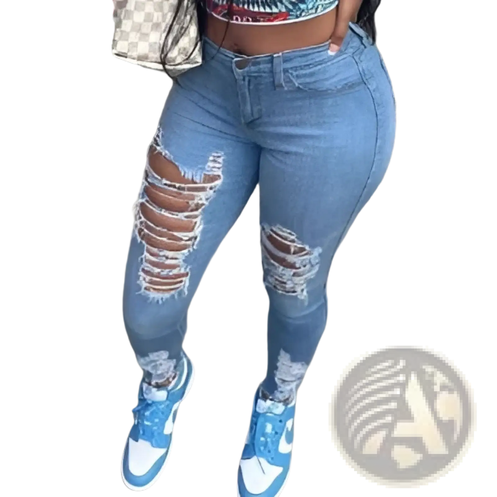 Distressed high waist light wash denim jeans in blue with ripped knee details made from denim material