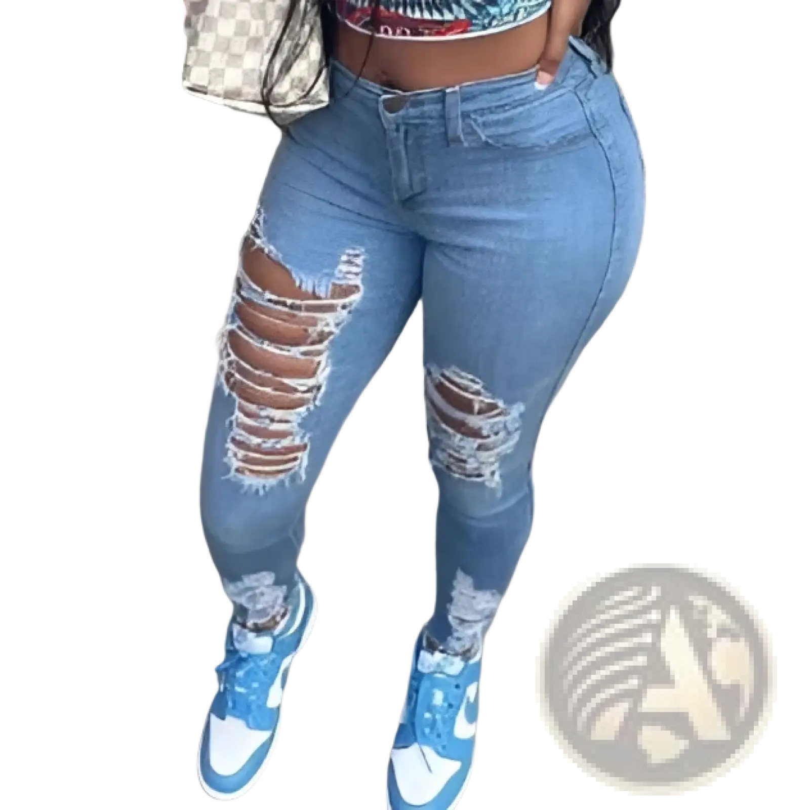 Distressed high waist light wash denim jeans in blue with ripped knee details made from denim material