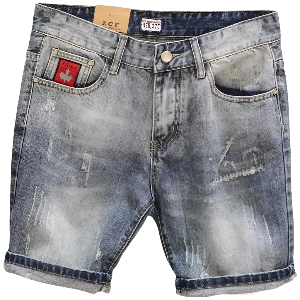 Distressed maple leaf denim shorts in blue with faded wash, rolled cuffs, and red maple leaf patch on front pocket