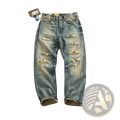 Distressed patchwork denim jeans men in blue with multiple ripped patches and rolled cuffs made of denim material