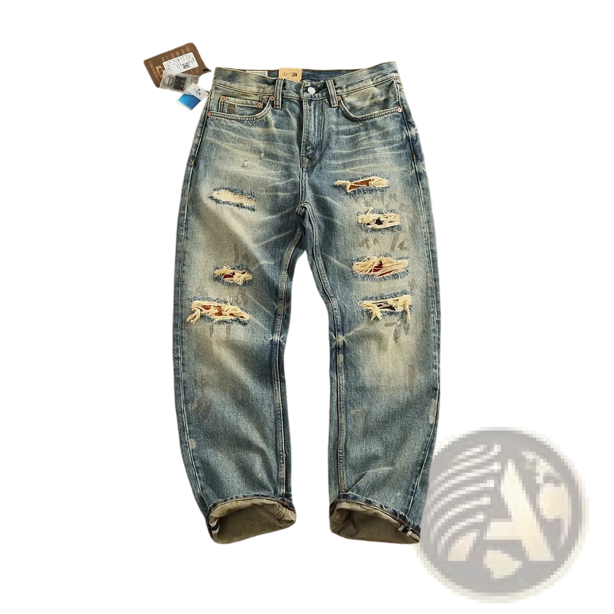 Distressed patchwork denim jeans men in blue with multiple ripped patches and rolled cuffs made of denim material