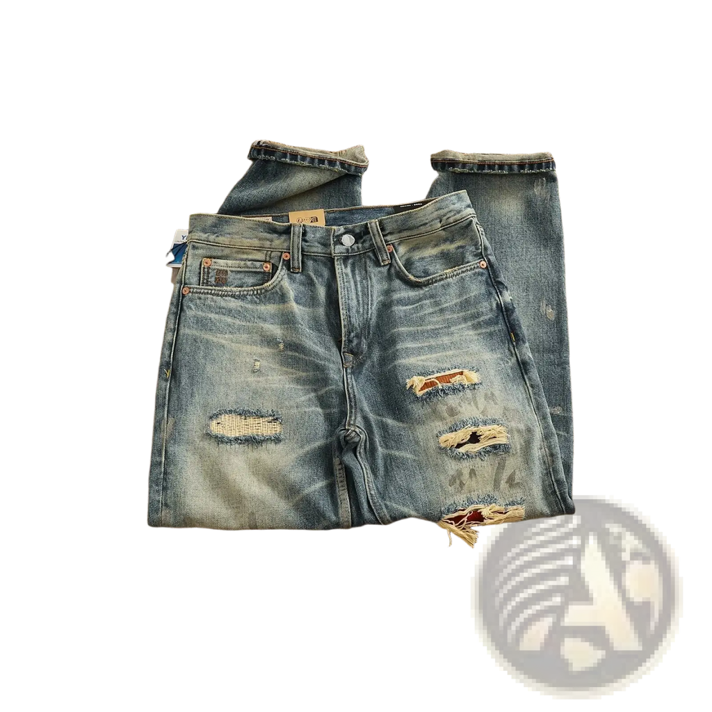 Distressed patchwork denim jeans men in blue with intentional rips frayed edges and classic five-pocket design