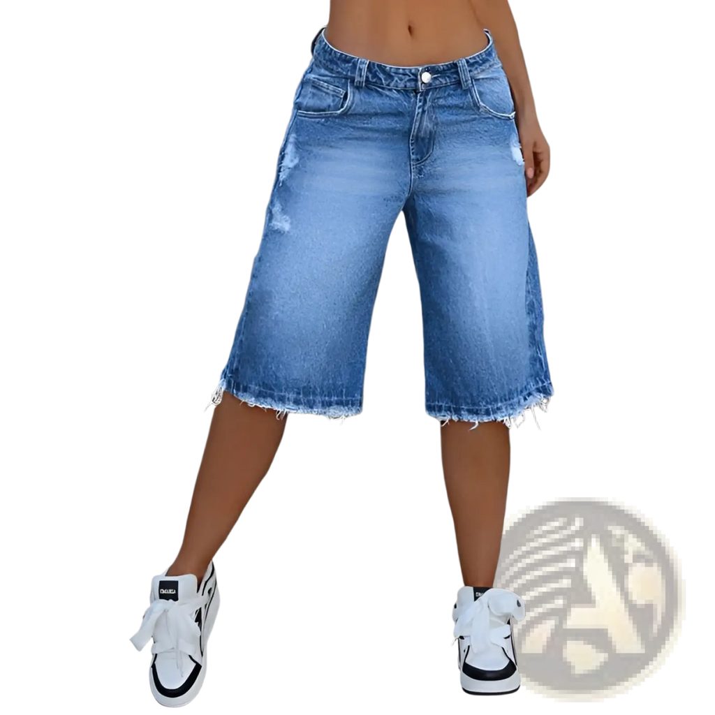 Distressed ripped denim capri pants in blue with classic five-pocket design and frayed hem detail