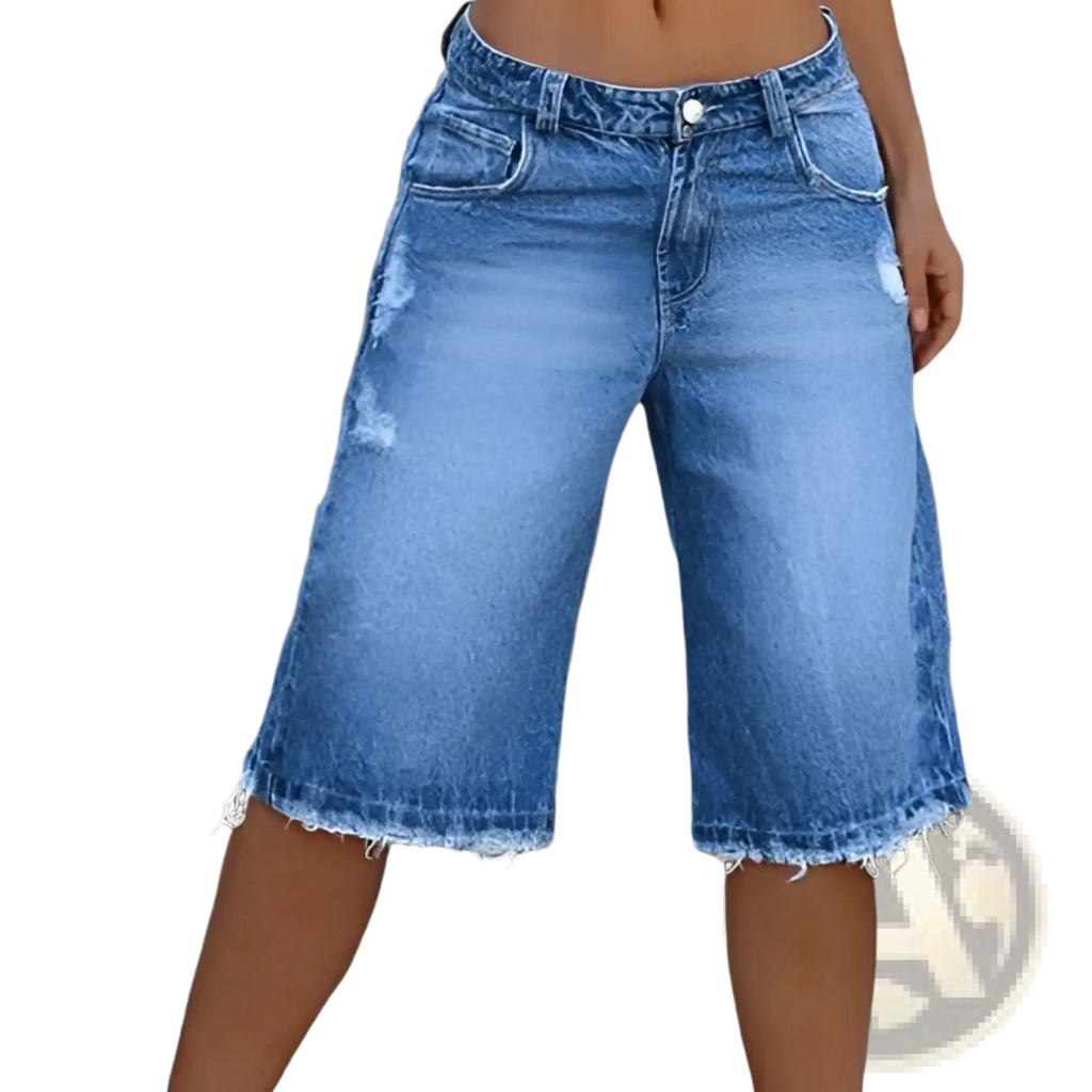 Distressed ripped denim capri pants in blue denim with a frayed hem and classic five-pocket design