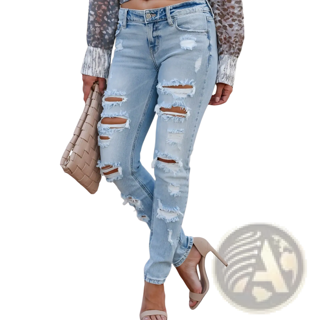 Distressed ripped skinny denim pants in light-wash denim with multiple distressed rips and frayed edges