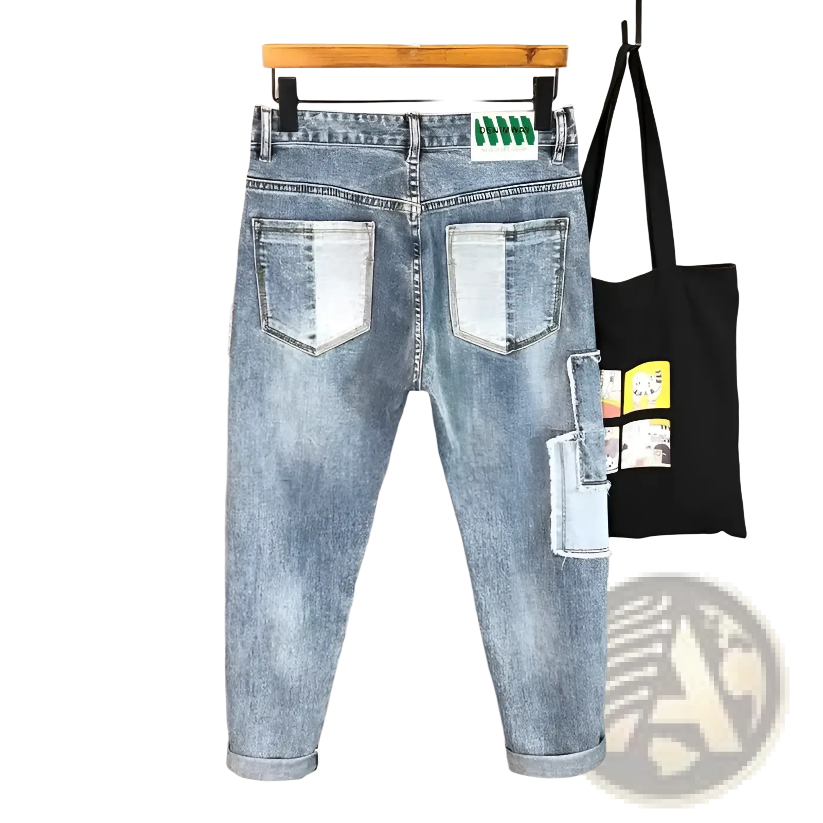 Back side of distressed slim fit light wash denim jeans with faded look and patchwork detailing on back pockets