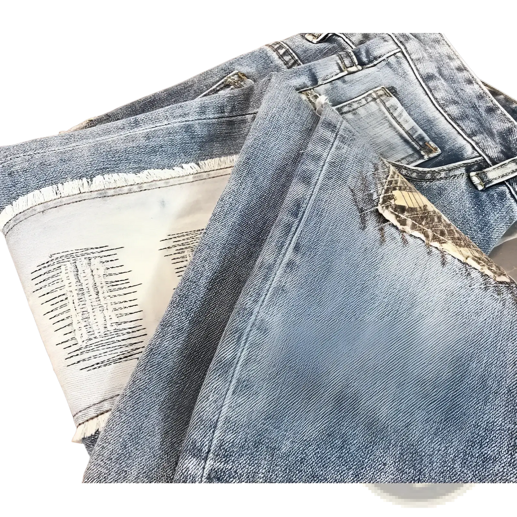Distressed slim fit light wash denim jeans with frayed edges, snake-skin texture patch, and black stitching