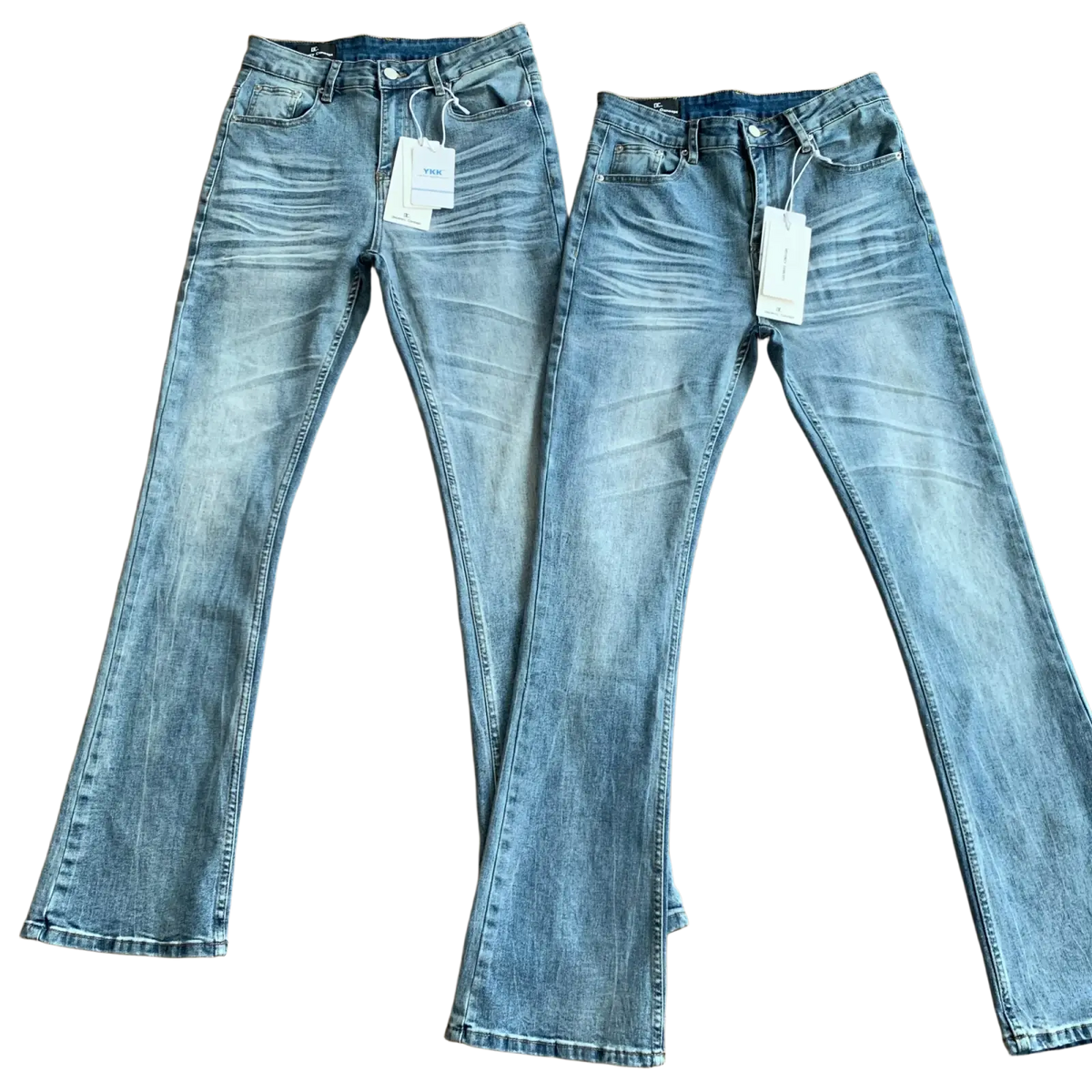 Distressed slim flare jeans in light-wash denim with flared leg cut, subtle fading, classic stitching, and button closures