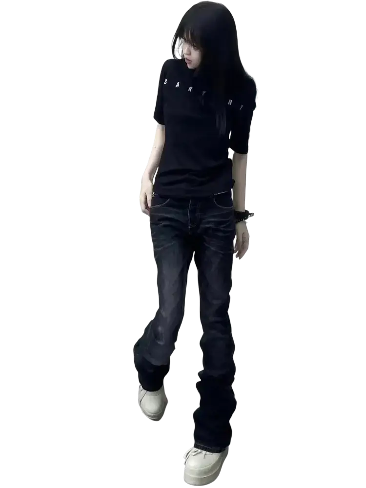 Black short-sleeved polo shirt with sanyi lettering paired with distressed slim flare black denim jeans