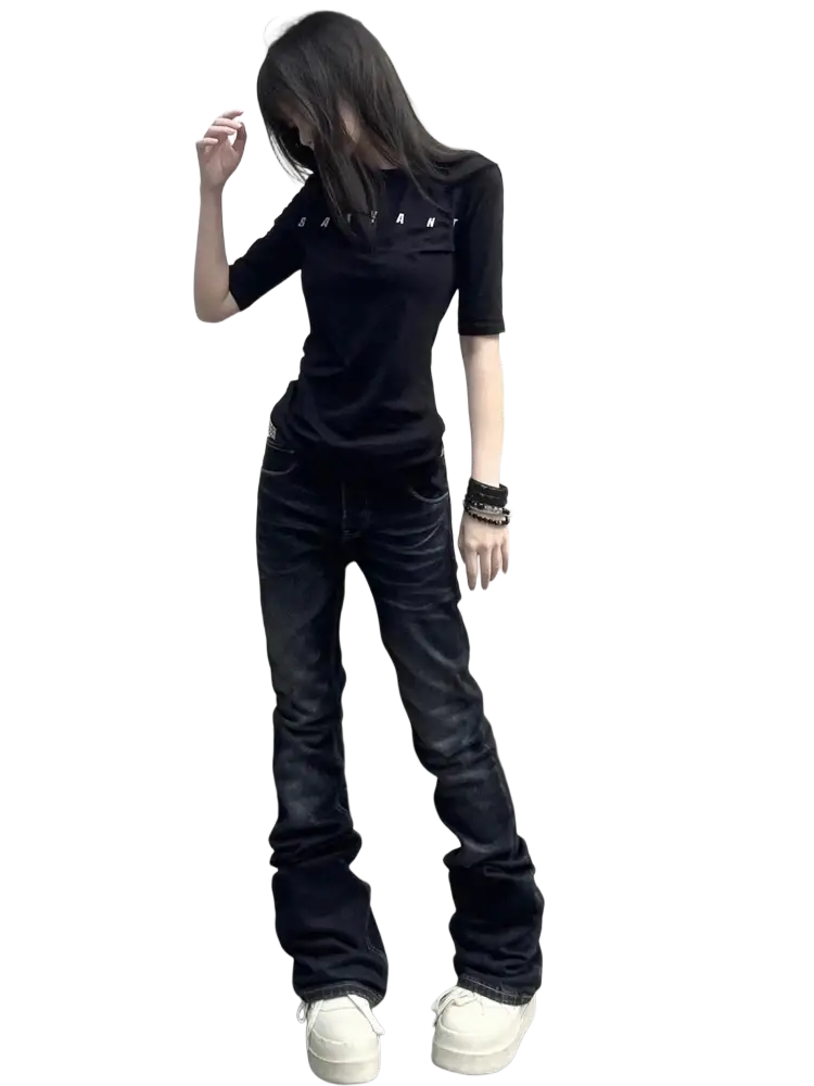 Black short sleeved t shirt with satan print paired with distressed slim flare black denim flare jeans