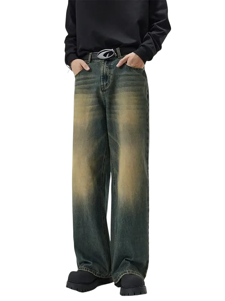Distressed vintage baggy men denim jeans in dark wash with a faded gradient effect transitioning to lighter tones at the bottom