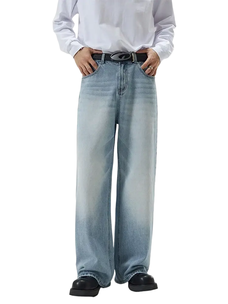 Distressed vintage baggy men denim jeans in light-wash denim with a wide-leg cut and faded gradient effect