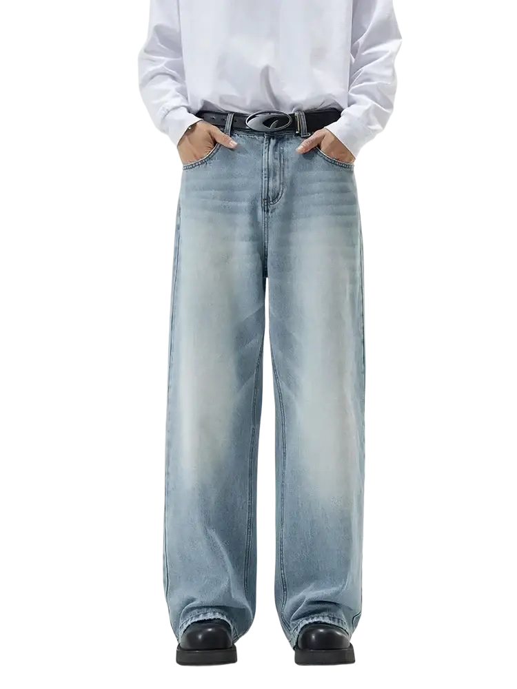 Distressed vintage baggy men denim jeans in light-wash denim with wide-leg cut and faded distressing detail