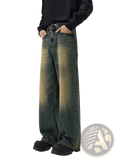 Distressed vintage baggy men denim jeans featuring wide-leg denim with a faded gradient wash from dark green to mustard yellow