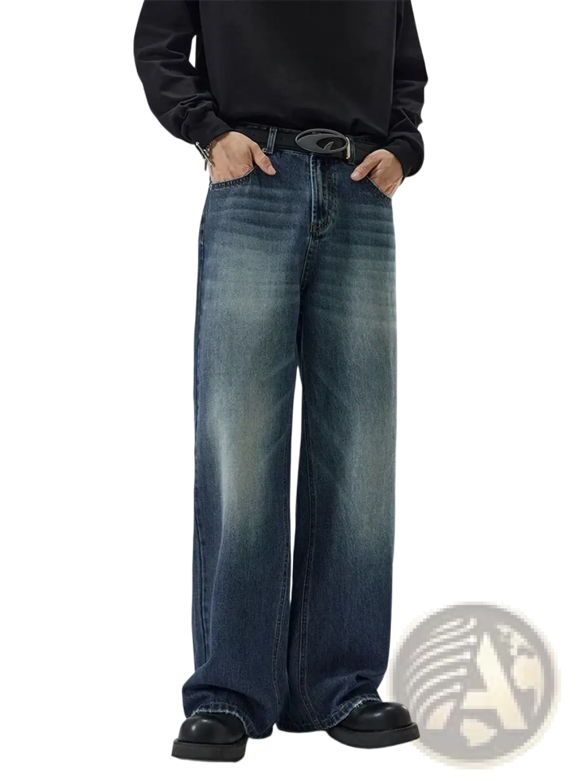 Distressed vintage baggy men denim jeans in faded blue wash with subtle whiskering and frayed hems