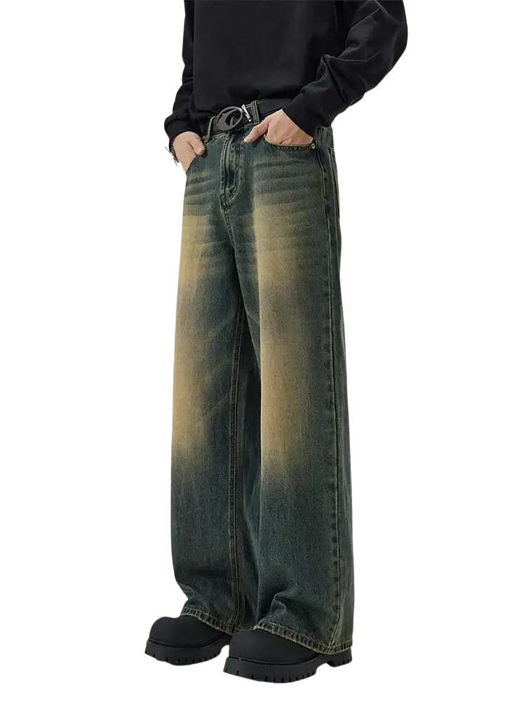 Distressed vintage baggy men denim jeans featuring wide-leg denim with a faded gradient wash from dark green to mustard yellow