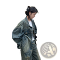 Distressed vintage denim jacket in faded blue with relaxed oversized fit and visible stitching details for streetwear
