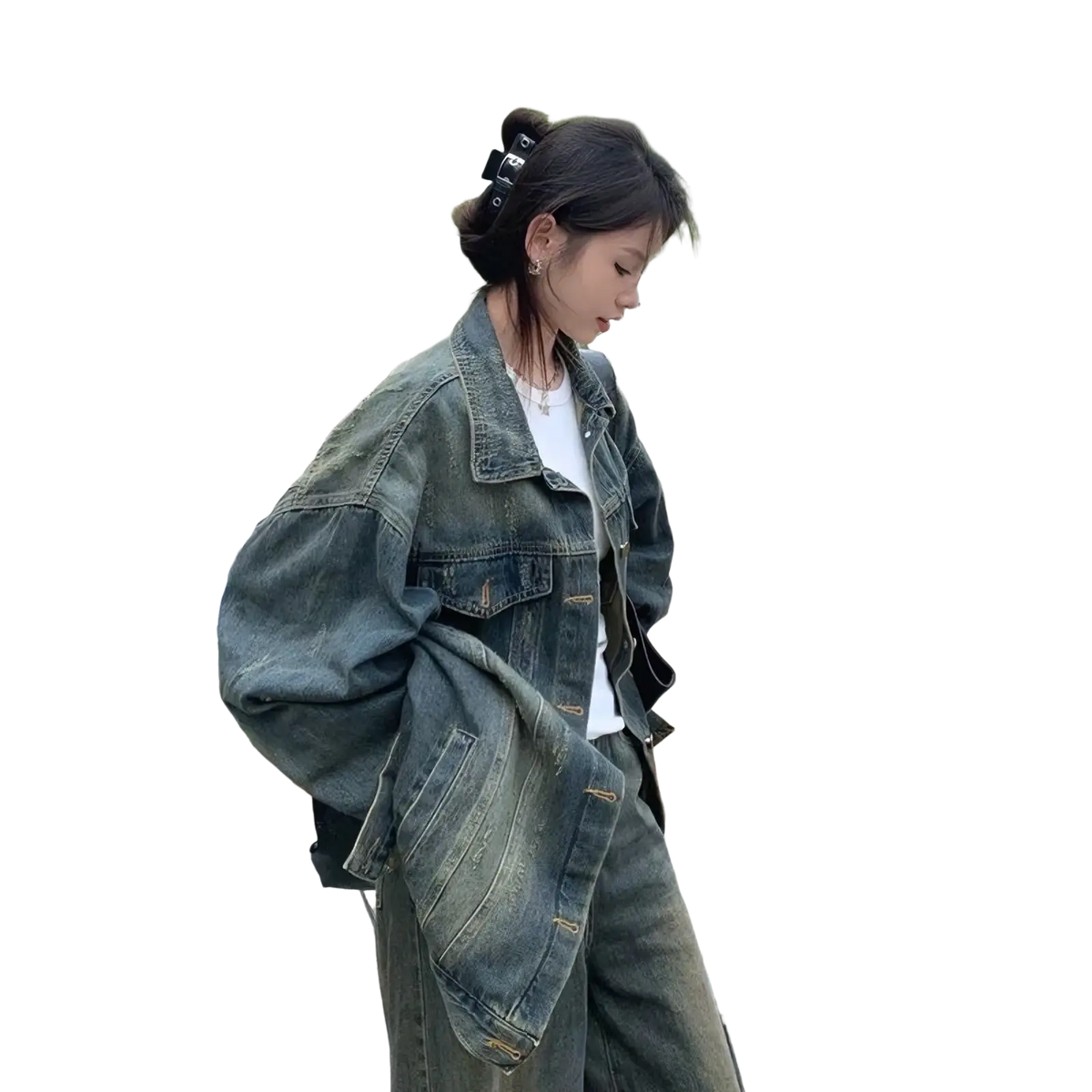 Distressed vintage denim jacket in faded blue with relaxed oversized fit and visible stitching details for streetwear